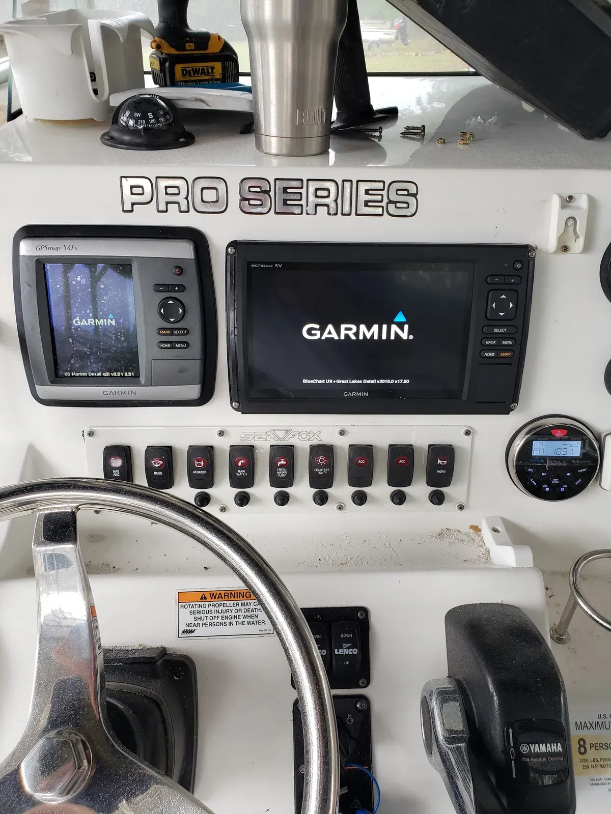 Garmin chartplotter and fish finder installed at a boat helm