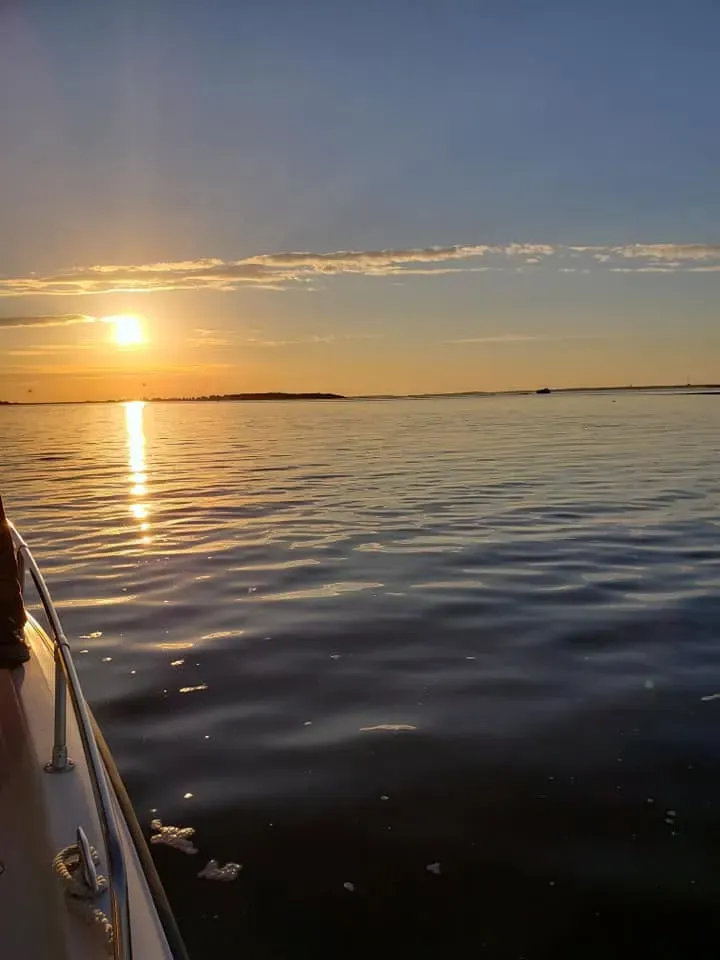 Angler with a fish on a boat
