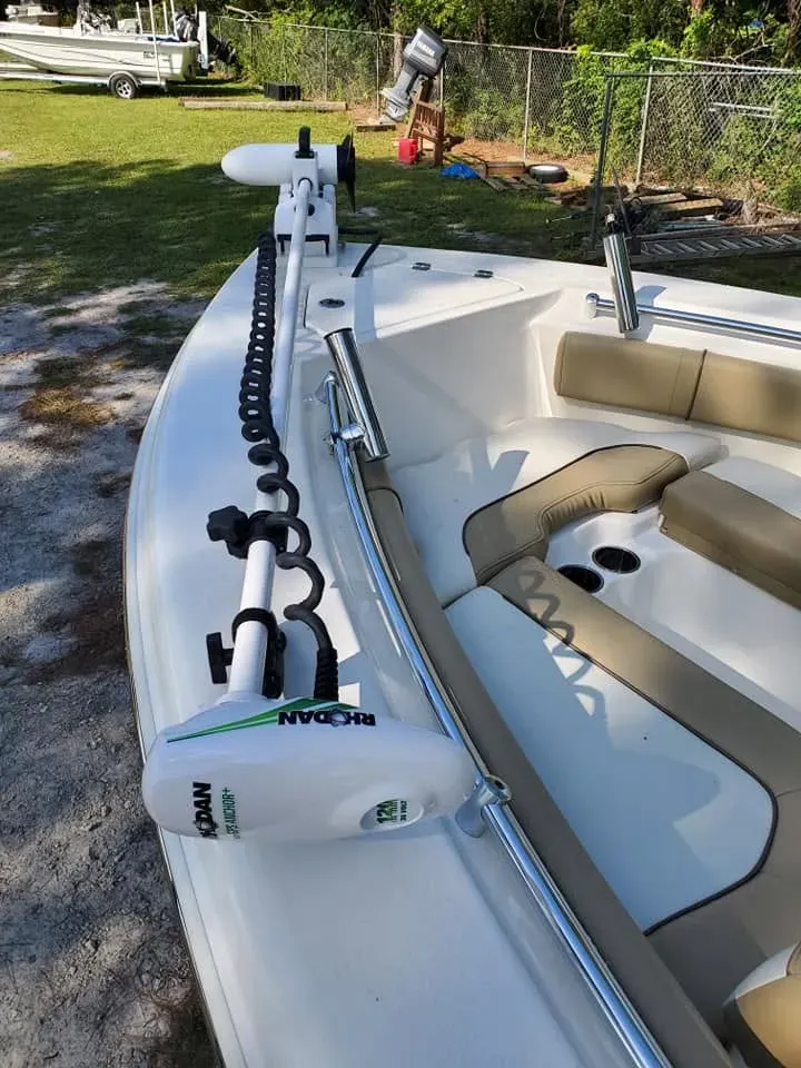 Bow of a seafoam center console on a trailer