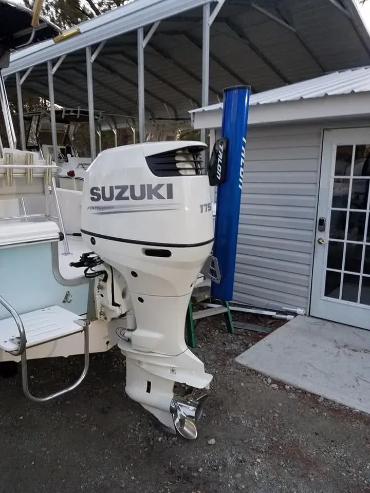 Suzuki outboard on a boat at the shop