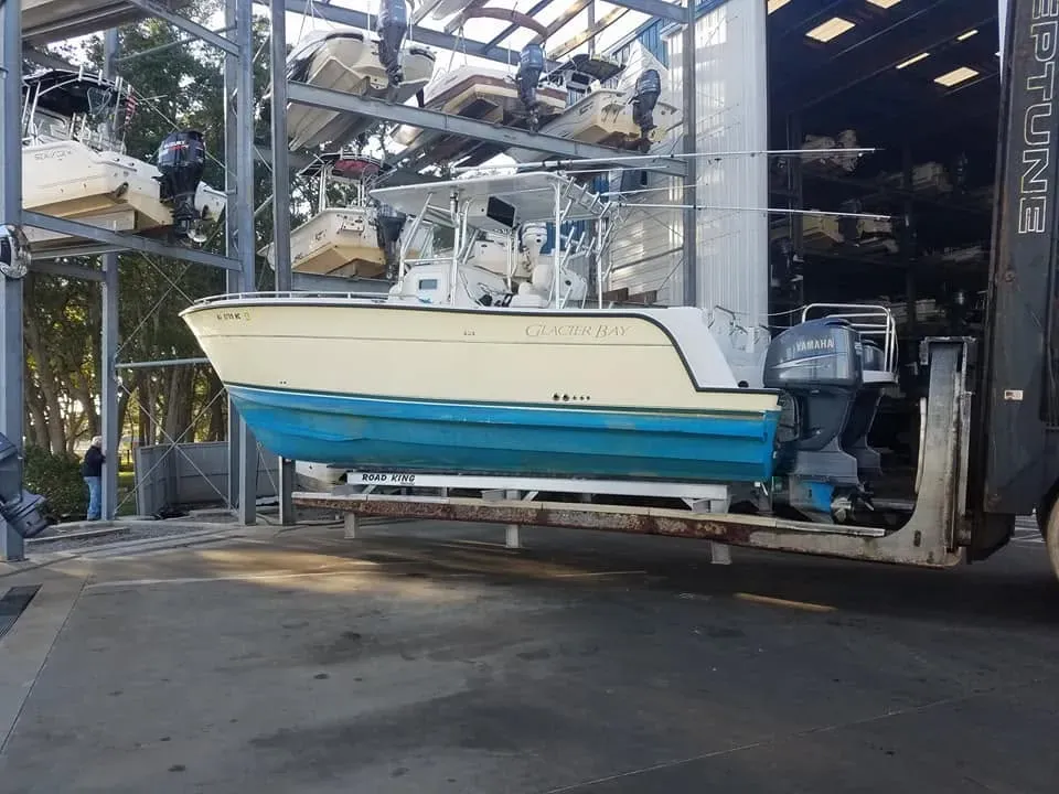 Glacier Bay catamaran with twin Yamaha outboards on a forklift
