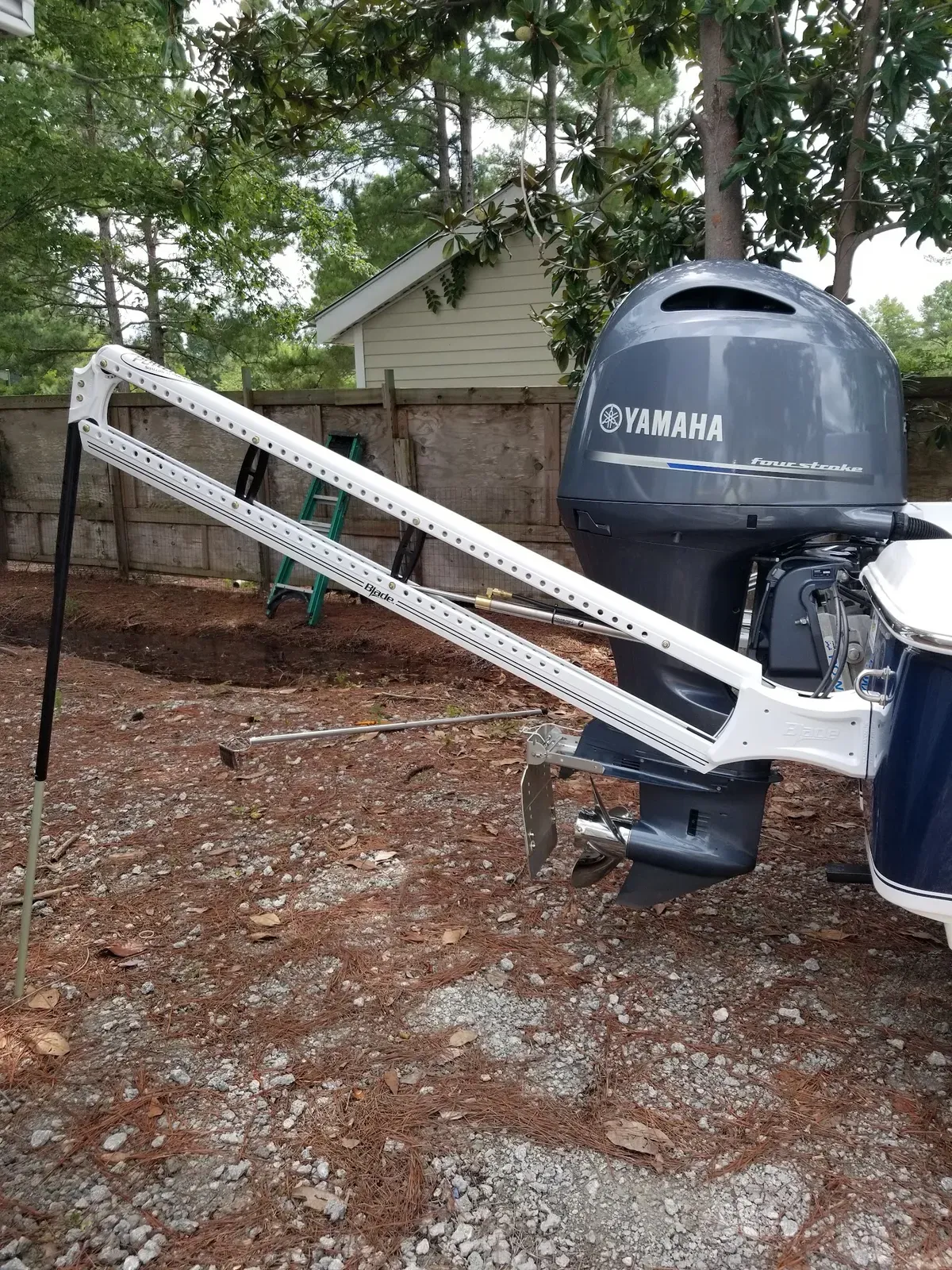 Yamaha four-stroke outboard on a center console at the Action Marine shop